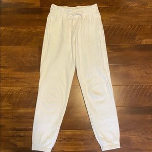 Aritzia TNA boyfriend sweatpants in white